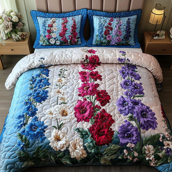 Petal Cascade quilted 3-piece bedding set on a made bed with two matching pillow shams
