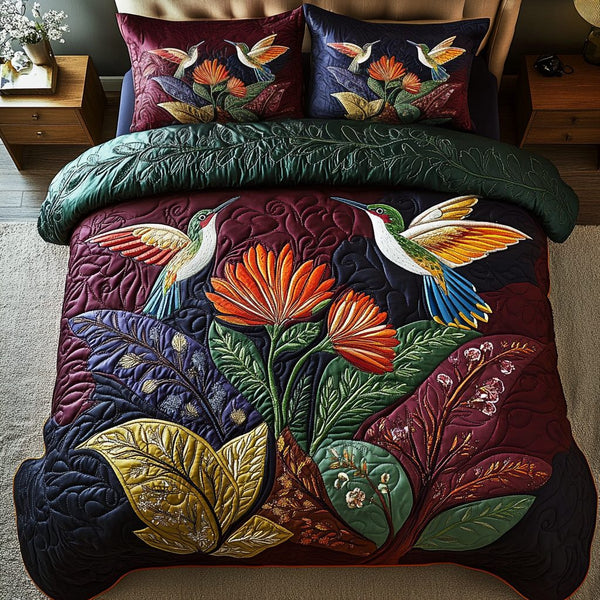 Petal Dreams quilted 3-piece bedding set on a made bed with two matching pillow shams