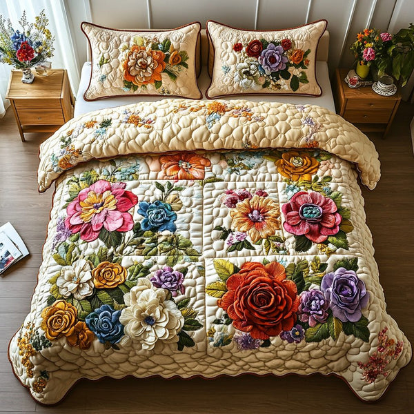 Petal Dreams quilted 3-piece bedding set on a made bed with two matching pillow shams