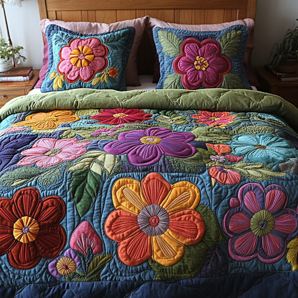 Petal Dreams quilted 3-piece bedding set on a made bed with two matching pillow shams