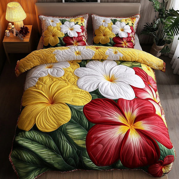 Petal Dreams quilted 3-piece bedding set on a made bed with two matching pillow shams