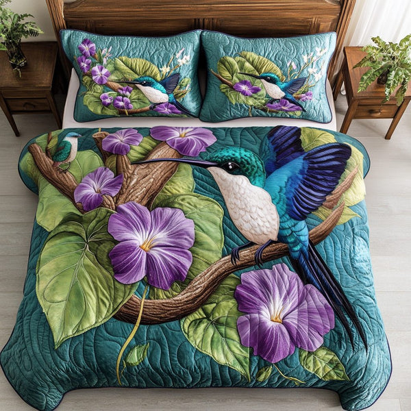 Petal Flutter quilted 3-piece bedding set on a made bed with two matching pillow shams