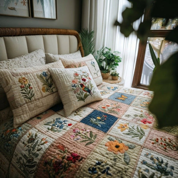 Petal Garden quilted 3-piece bedding set on a made bed with two matching pillow shams