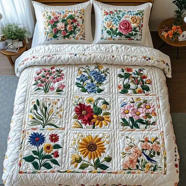 Petal Grace quilted 3-piece bedding set on a made bed with two matching pillow shams