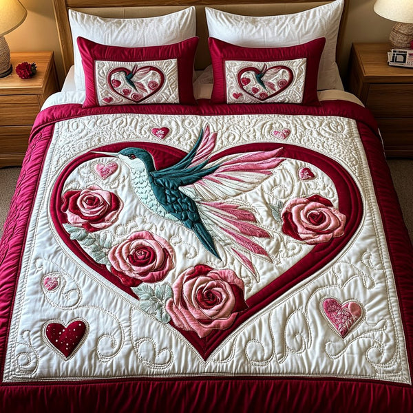 Petal Grace quilted 3-piece bedding set on a made bed with two matching pillow shams