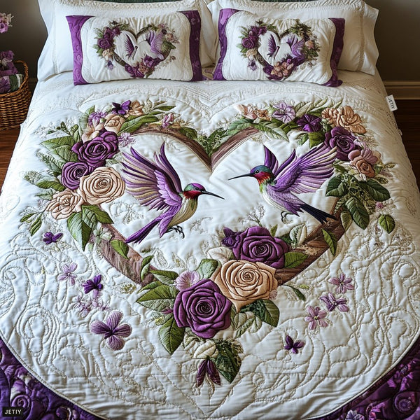 Petal Pair quilted 3-piece bedding set on a made bed with two matching pillow shams