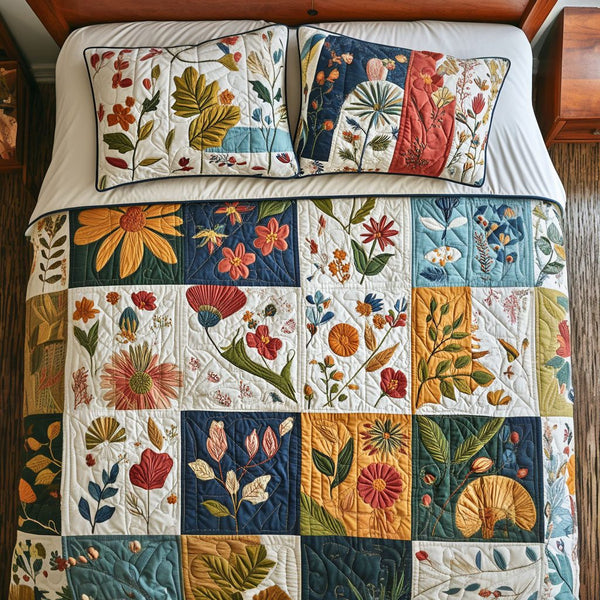 Petal Parade quilted 3-piece bedding set on a made bed with two matching pillow shams