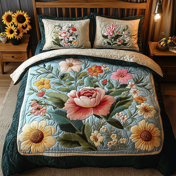 Petal Perfect quilted 3-piece bedding set on a made bed with two matching pillow shams