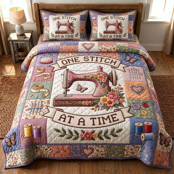Petal Stitchery quilted 3-piece bedding set on a made bed with two matching pillow shams