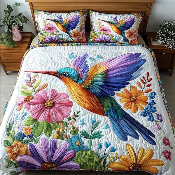 Petal Wings quilted 3-piece bedding set on a made bed with two matching pillow shams