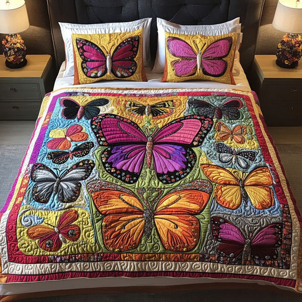 Petals and Wings quilted 3-piece bedding set on a made bed with two matching pillow shams