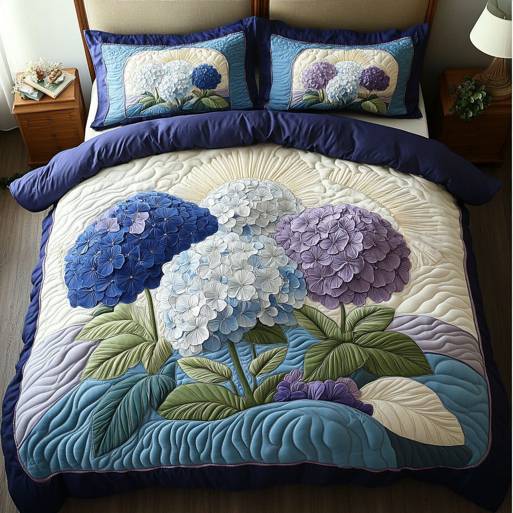 Petals in Full Bloom quilted 3-piece bedding set on a made bed with two matching pillow shams