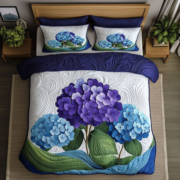 Petals in the Breeze quilted 3-piece bedding set on a made bed with two matching pillow shams