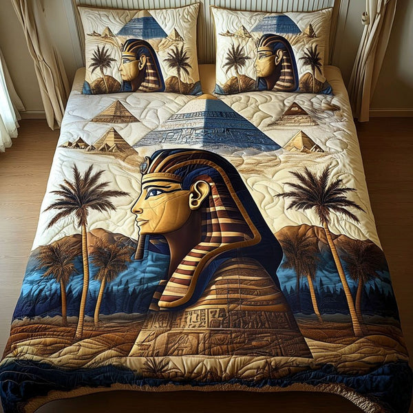 Pharaoh Legacy quilted 3-piece bedding set on a made bed with two matching pillow shams