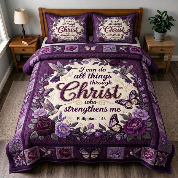 Philippians 413 quilted 3-piece bedding set on a made bed with two matching pillow shams
