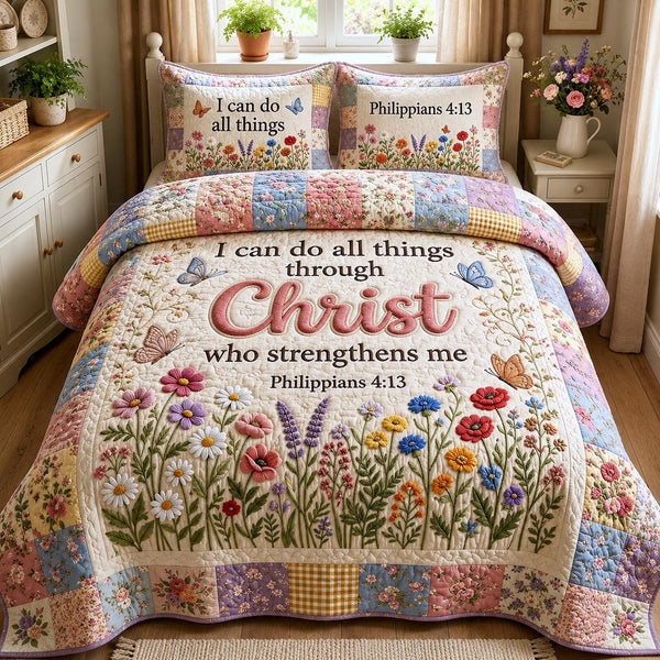 Philippians 413 quilted 3-piece bedding set on a made bed with two matching pillow shams