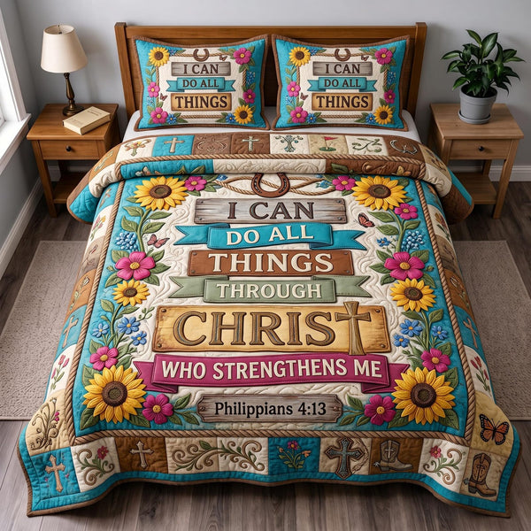 Philippians 413 quilted 3-piece bedding set on a made bed with two matching pillow shams