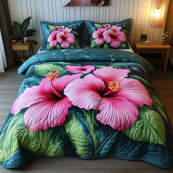 Pink Blossom Garden quilted 3-piece bedding set on a made bed with two matching pillow shams