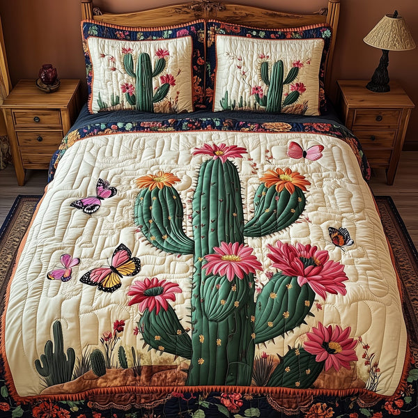 Pink Desert Flower quilted 3-piece bedding set on a made bed with two matching pillow shams