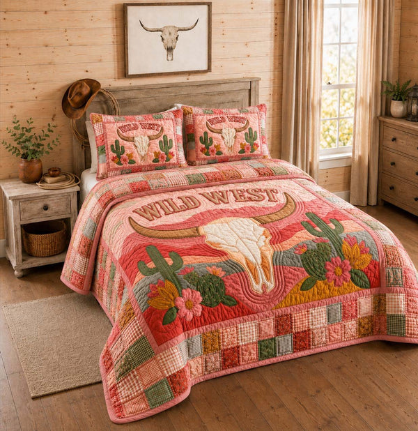 Pink Desert Skull quilted 3-piece bedding set on a made bed against a dark styled interior