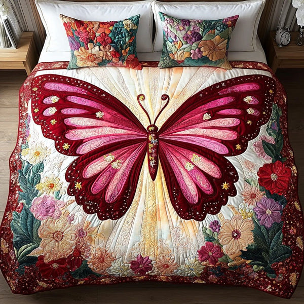 Pink Glow quilted 3-piece bedding set on a made bed with two matching pillow shams
