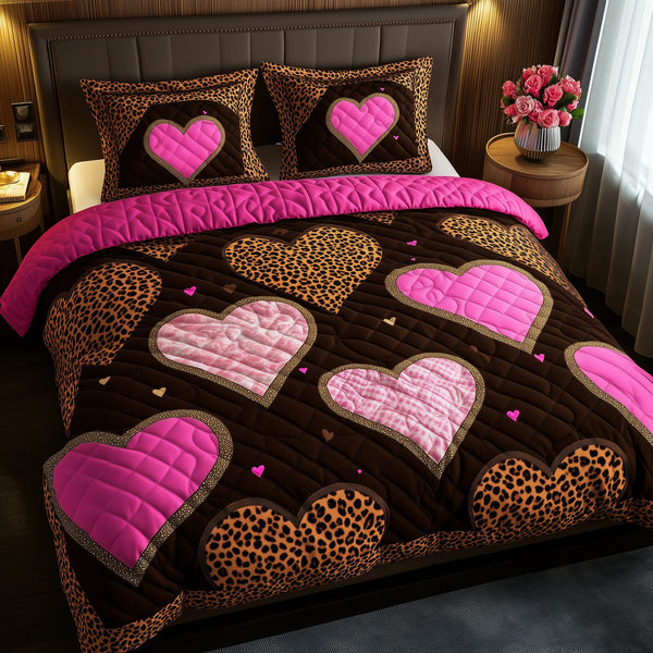 Pink Leopard Heart quilted 3-piece bedding set on a made bed with two matching pillow shams