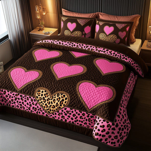 Pink Leopard Heart quilted 3-piece bedding set on a made bed with two matching pillow shams