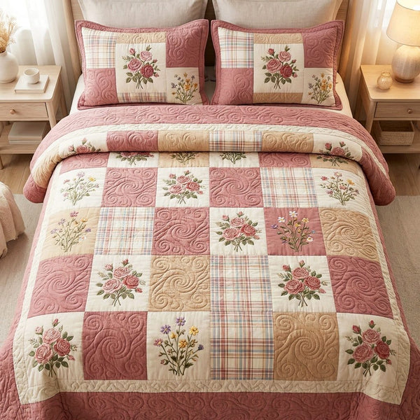 Pink Meadow quilted 3-piece bedding set on a made bed with two matching pillow shams