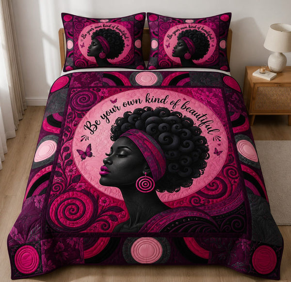 Pink Melanin Queen quilted 3-piece bedding set on a made bed with two matching pillow shams