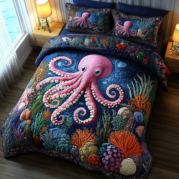 Pink Paradise quilted 3-piece bedding set on a made bed with two matching pillow shams