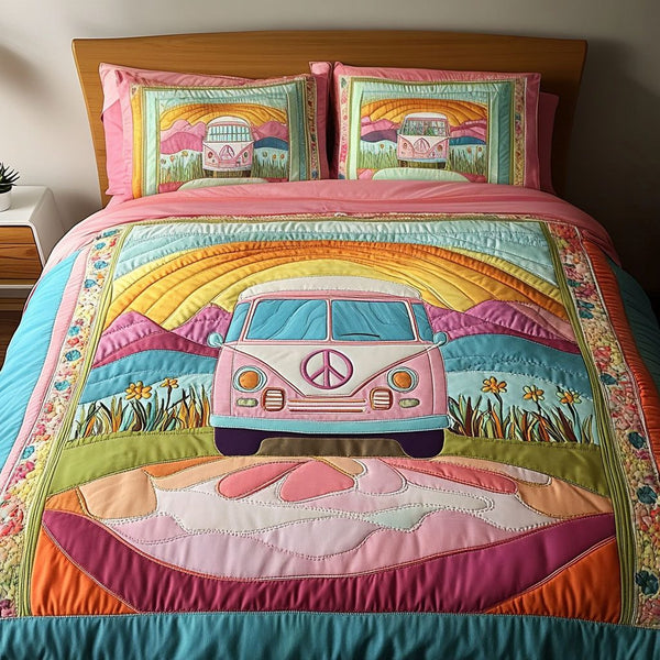 Pink Van Escape quilted 3-piece bedding set on a made bed with two matching pillow shams