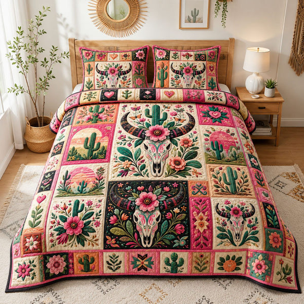 Pink Western Floral Longhorn Skull quilted 3-piece bedding set on a made bed against a dark styled interior