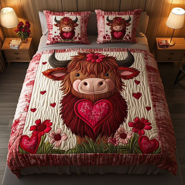 Pinky Highland Cow quilted 3-piece bedding set on a made bed with two matching pillow shams