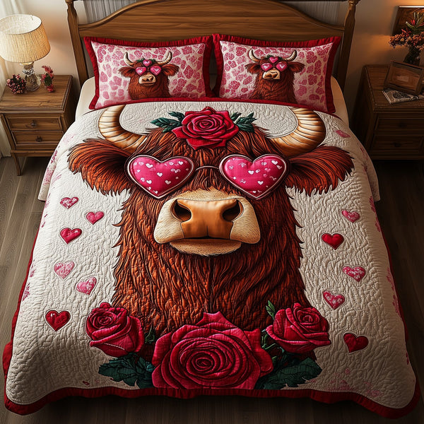 Pinky Highland Cow quilted 3-piece bedding set on a made bed with two matching pillow shams