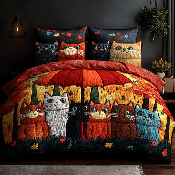 Playful Cat quilted 3-piece bedding set on a made bed with two matching pillow shams