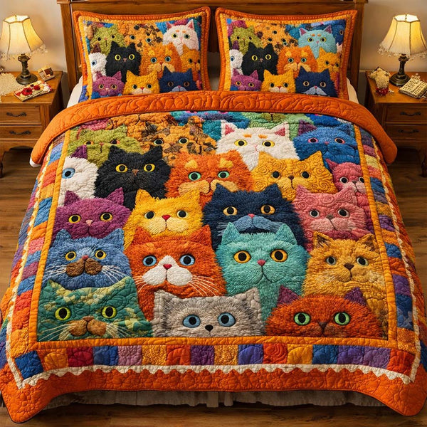 Playful Cats quilted 3-piece bedding set on a made bed with two matching pillow shams