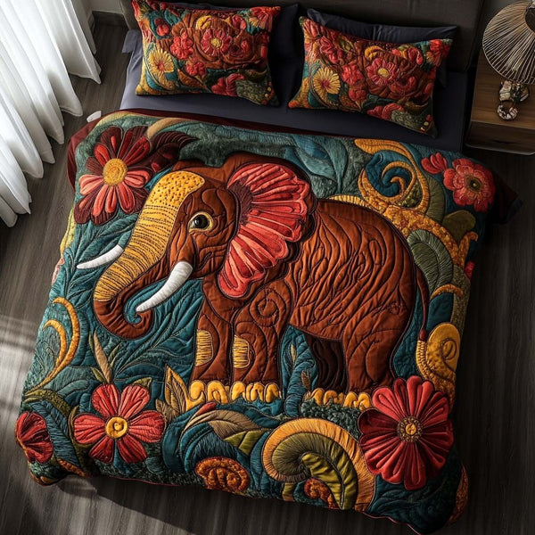 Playful Elephant Hugs quilted 3-piece bedding set on a made bed with two matching pillow shams