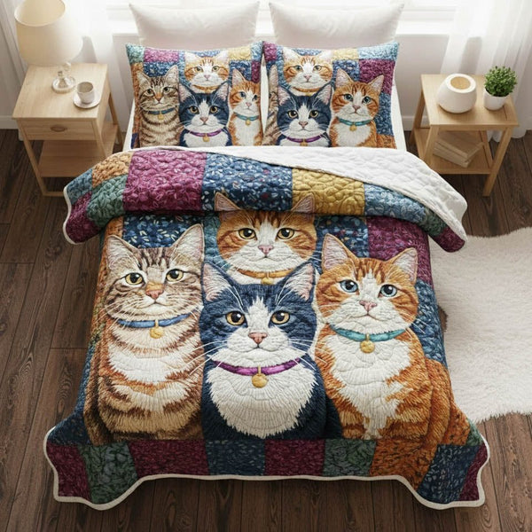 Playful Kittens quilted 3-piece bedding set on a made bed with two matching pillow shams