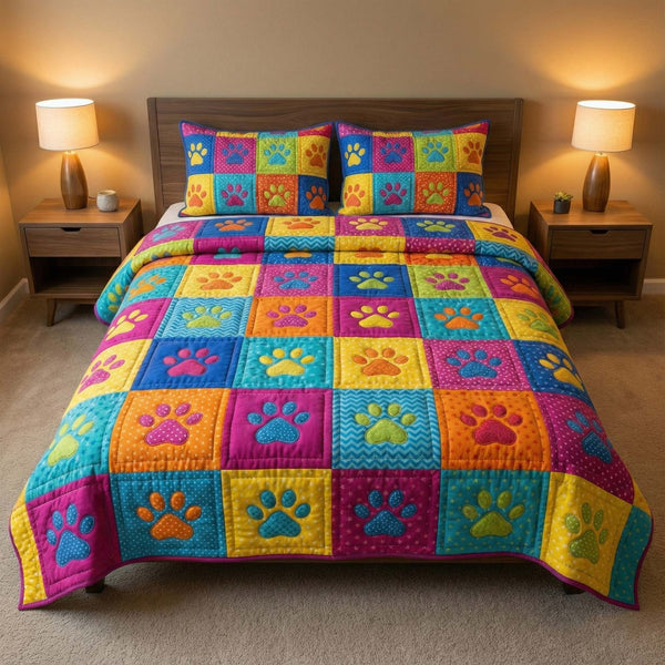 Playful Paws quilted 3-piece bedding set on a made bed with two matching pillow shams