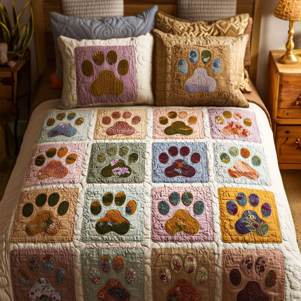 Playful Paws quilted 3-piece bedding set on a made bed with two matching pillow shams