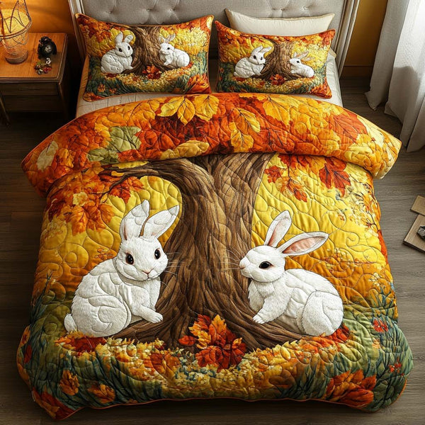 Playful Rabbits quilted 3-piece bedding set on a made bed with two matching pillow shams