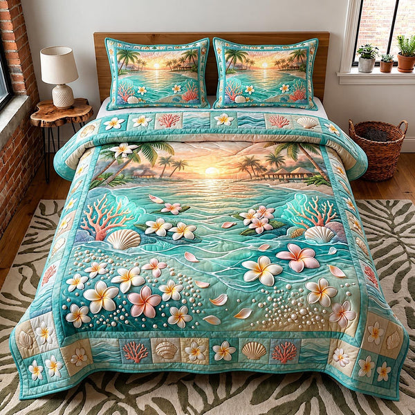 Plumeria Breeze quilted 3-piece bedding set on a made bed with two matching pillow shams
