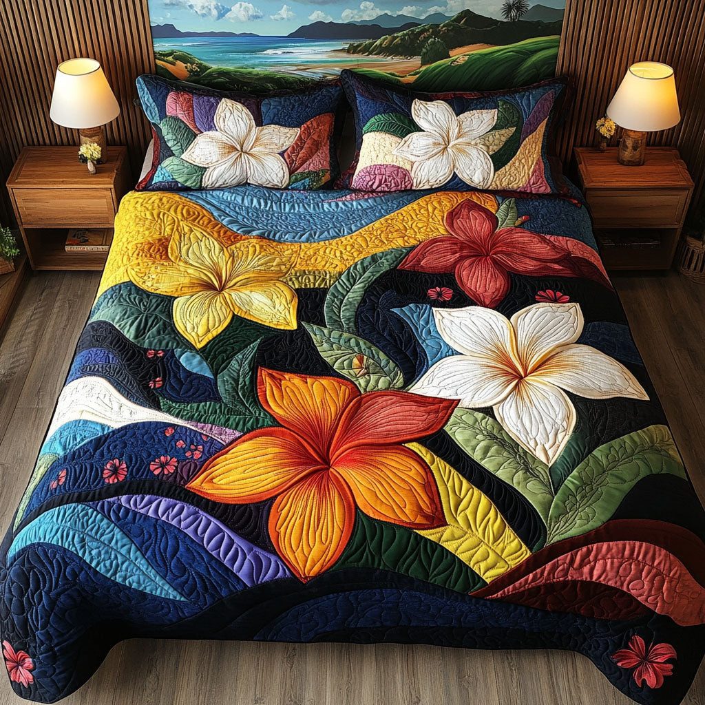 Plumeria Dream quilted 3-piece bedding set on a made bed with two matching pillow shams