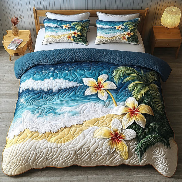 Plumeria Dreams quilted 3-piece bedding set on a made bed with two matching pillow shams