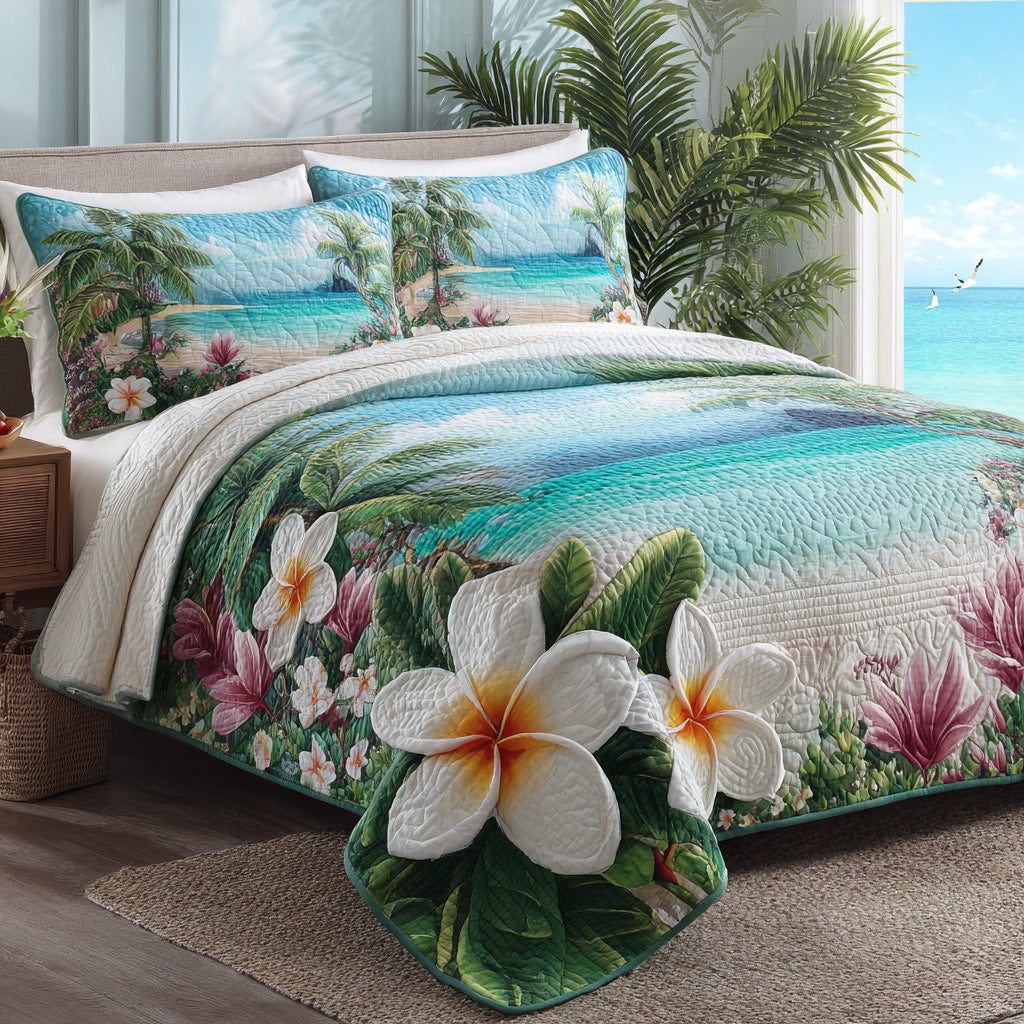 Plumeria Shore quilted 3-piece bedding set on a made bed in a light coastal bedroom