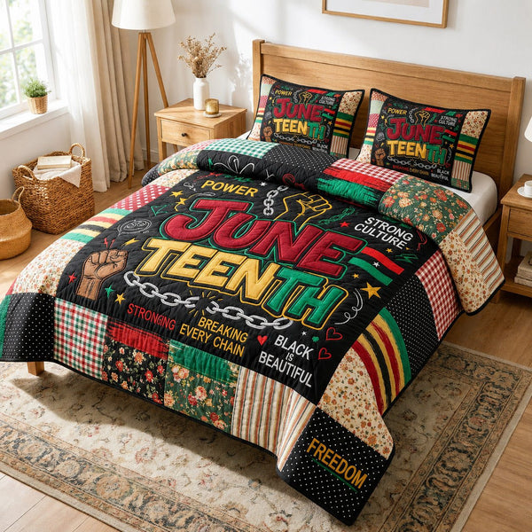 Power Juneteenth quilted 3-piece bedding set on a made bed in a warmly lit bedroom