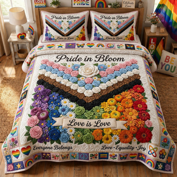Pride In Bloom quilted 3-piece bedding set on a made bed with two matching pillow shams
