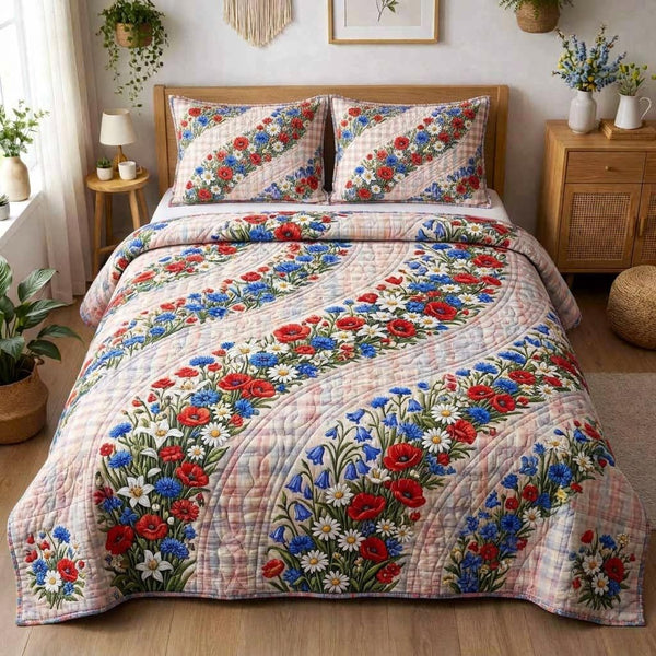 Proud Bloom quilted 3-piece bedding set on a made bed with two matching pillow shams