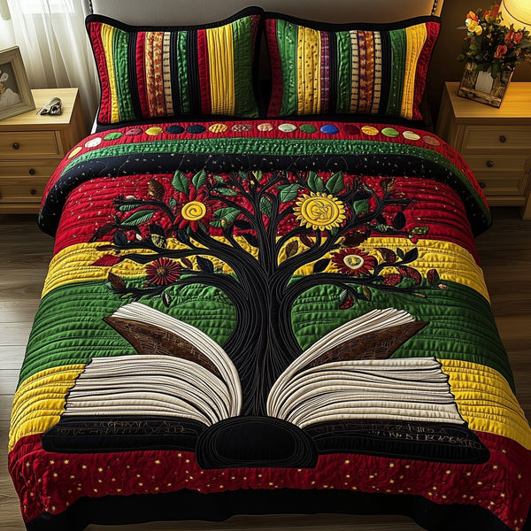 Proud Roots quilted 3-piece bedding set on a made bed with two matching pillow shams