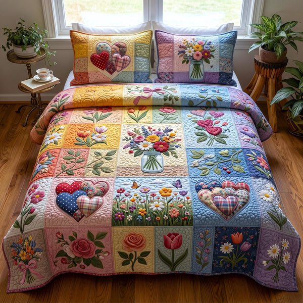 Proud to Love quilted 3-piece bedding set on a made bed with two matching pillow shams